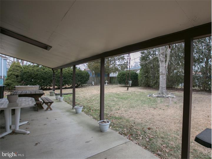 5 Evergreen Road Stratford, NJ 08084 - Photo 14 of 18 a view of a patio with a backyard