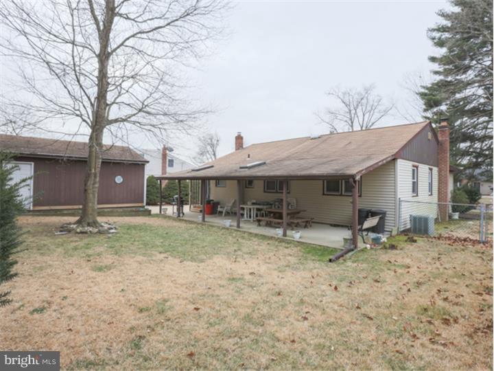 5 Evergreen Road Stratford, NJ 08084 - Photo 15 of 18 a house that has a tree in front of it