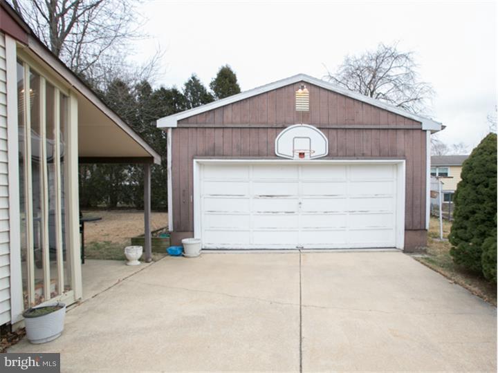 5 Evergreen Road Stratford, NJ 08084 - Photo 17 of 18 a view of a house with a yard and garage