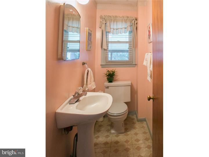 5 Evergreen Road Stratford, NJ 08084 - Photo 8 of 18 a bathroom with a sink a toilet and a mirror