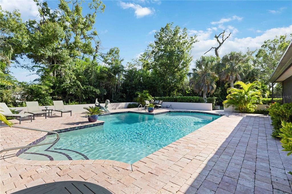 505 Lyons Bay Road Nokomis, FL 34275 - Photo 31 of 57 a view of a swimming pool with a patio
