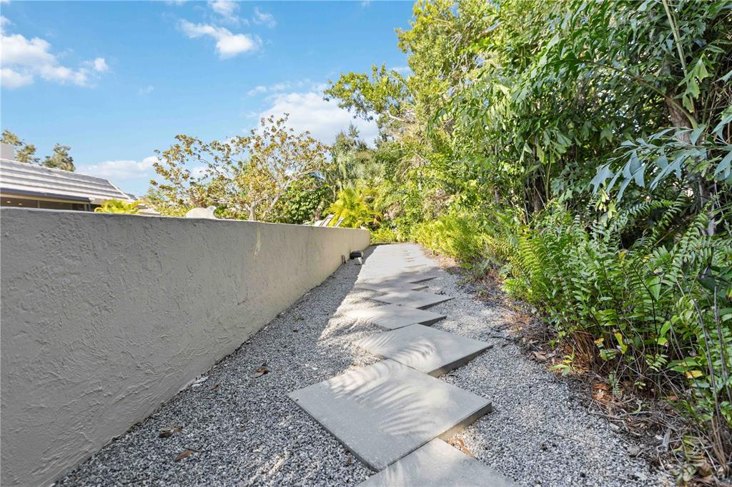505 Lyons Bay Road Nokomis, FL 34275 - Photo 37 of 57 a view of a garden with an outdoor space