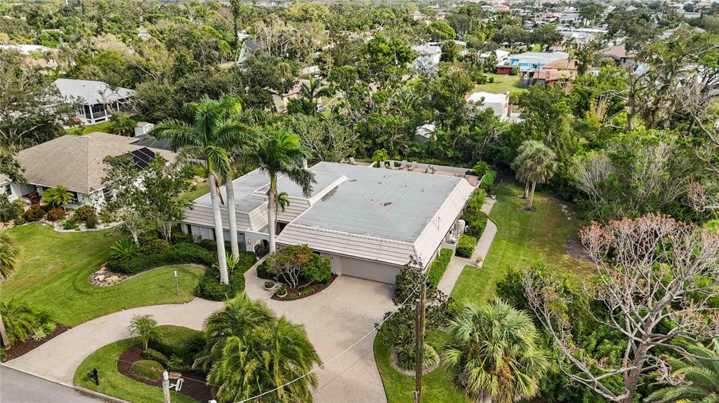 505 Lyons Bay Road Nokomis, FL 34275 - Photo 48 of 57 an aerial view of a house with a yard basket ball court and outdoor seating