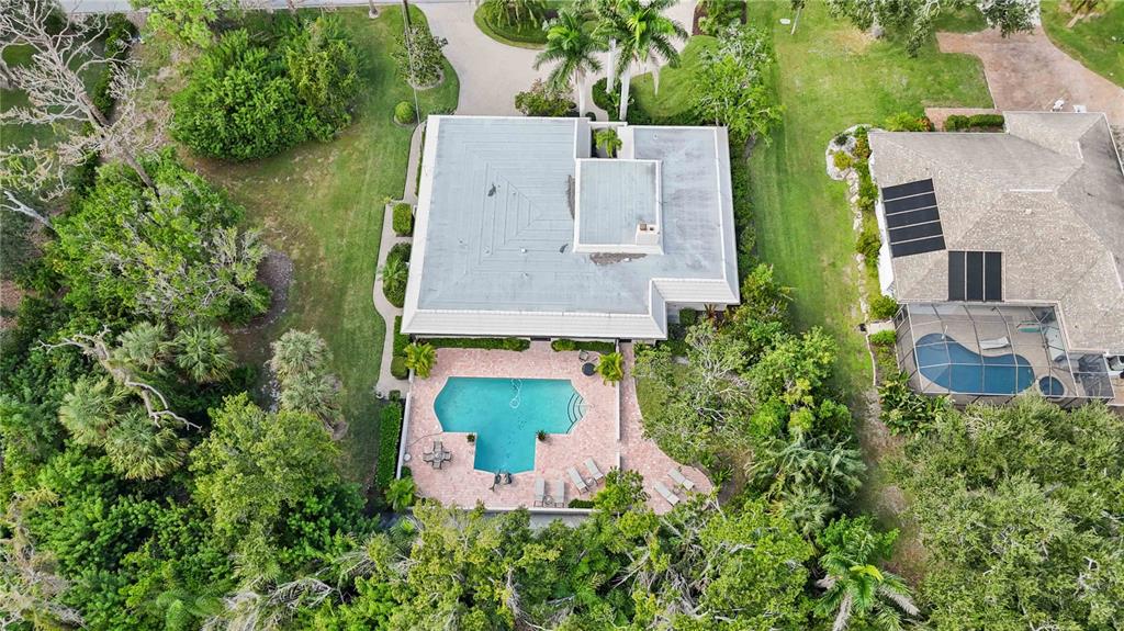 505 Lyons Bay Road Nokomis, FL 34275 - Photo 50 of 57 an aerial view of residential house with outdoor space and trees all around