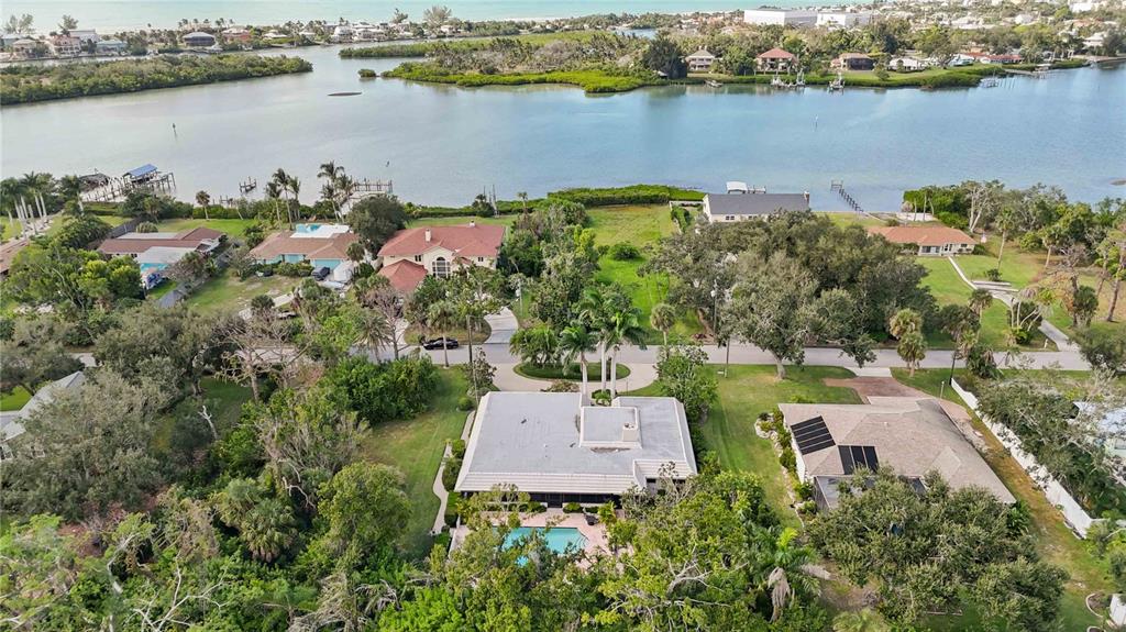 505 Lyons Bay Road Nokomis, FL 34275 - Photo 51 of 57 an aerial view of a house with a lake view