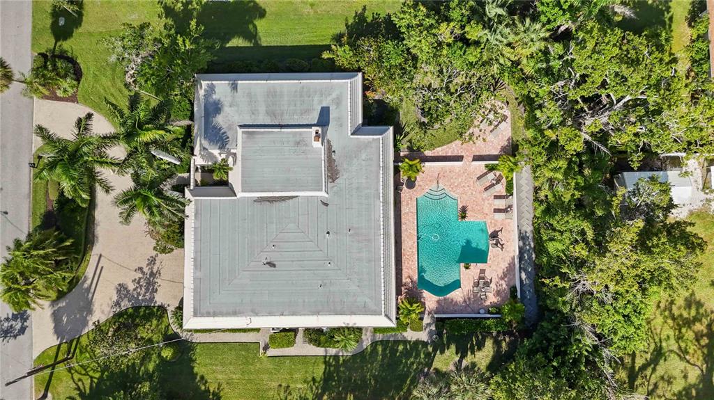 505 Lyons Bay Road Nokomis, FL 34275 - Photo 56 of 57 an aerial view of a house with a yard and plants