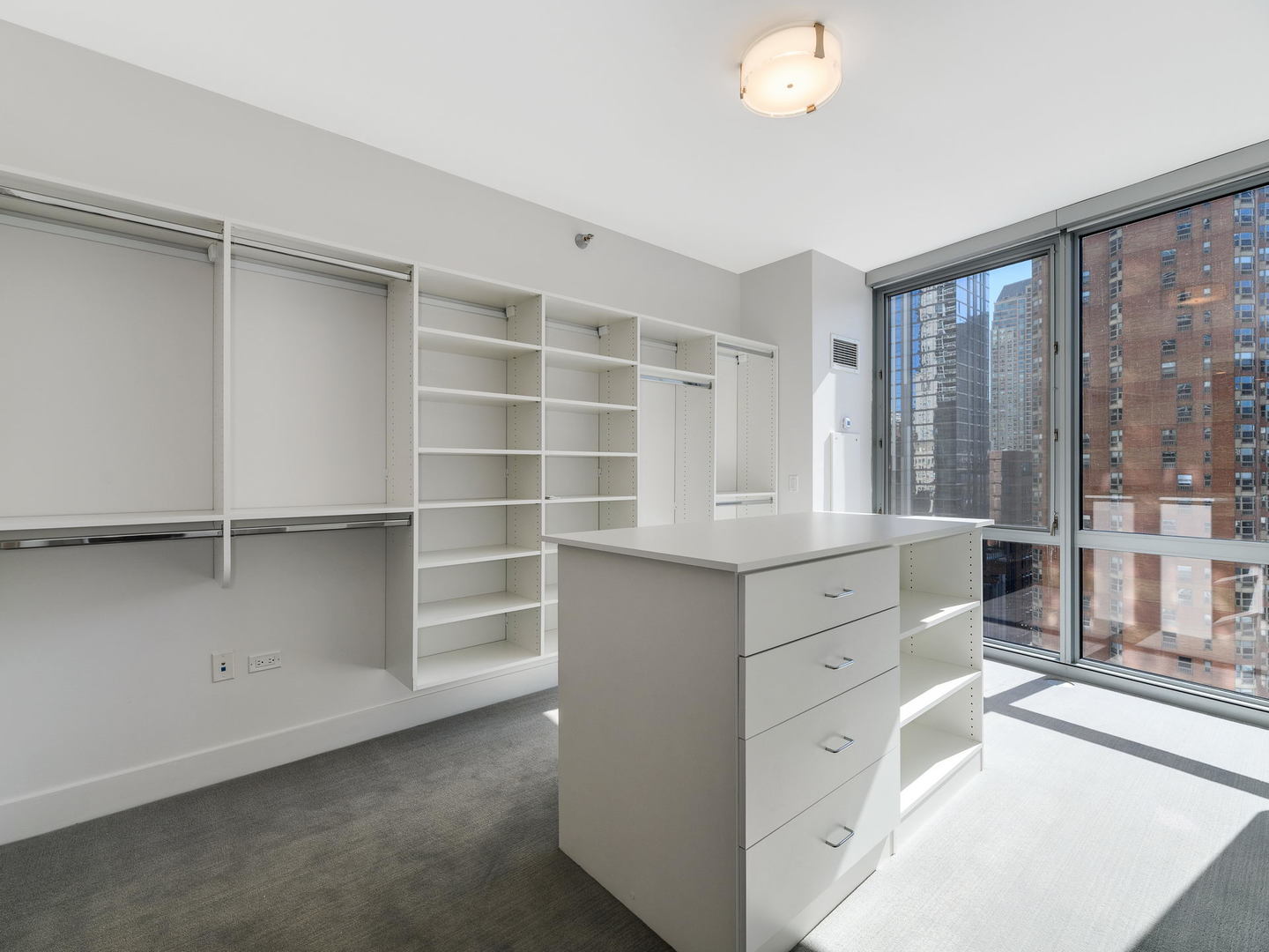 2 West Delaware Place, Unit 130304 Chicago, IL 60610 - Photo 9 of 19 a room with window and cabinet