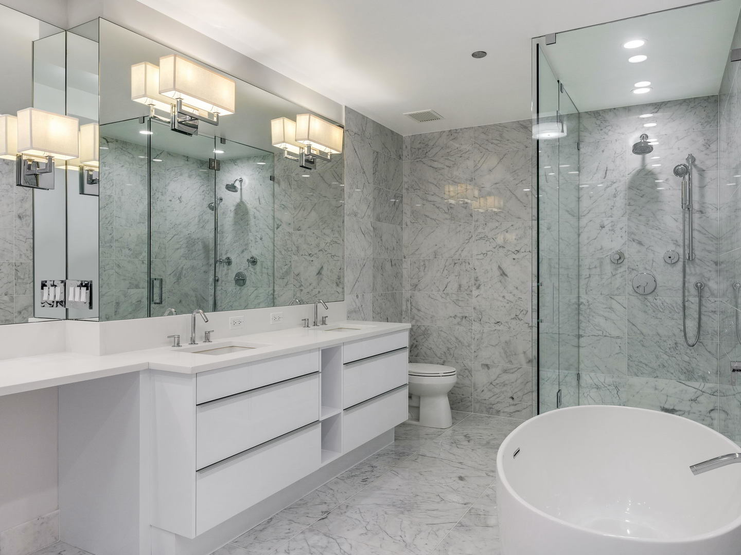 2 West Delaware Place, Unit 130304 Chicago, IL 60610 - Photo 10 of 19 a bathroom with a double vanity sink mirror and shower