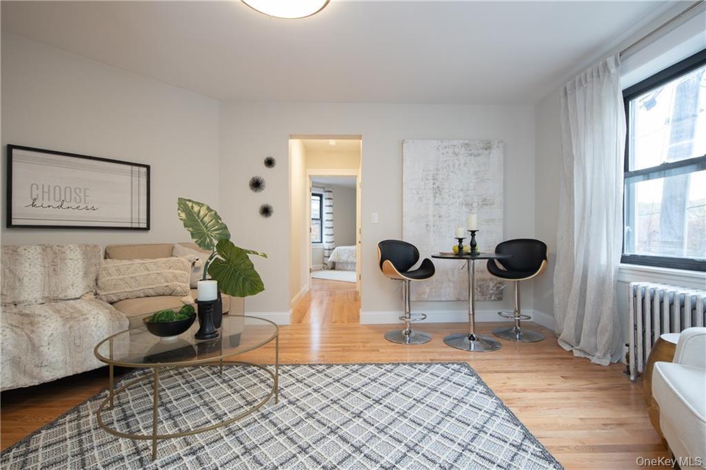 381 Broadway, Unit 1B Dobbs Ferry, NY 10522 - Photo 6 of 16 a living room with furniture and a large window