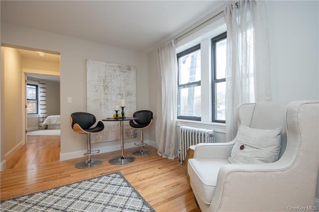381 Broadway, Unit 1B Dobbs Ferry, NY 10522 - Photo 9 of 16 a living room with furniture a window and chairs