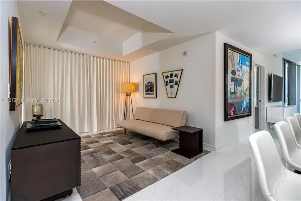 a living room with furniture and a window