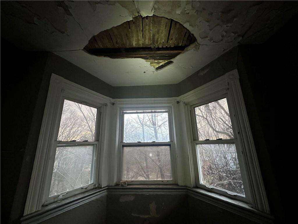 627 Chester Avenue Pittsburgh, PA 15214 - Photo 14 of 19 a view of room with a large window and wooden floor