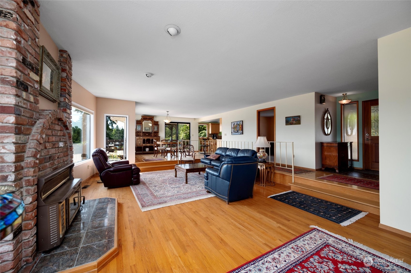13622 Trumpeter Lane Mount Vernon, WA 98273 - Photo 15 of 40 a living room with furniture windows and a fireplace