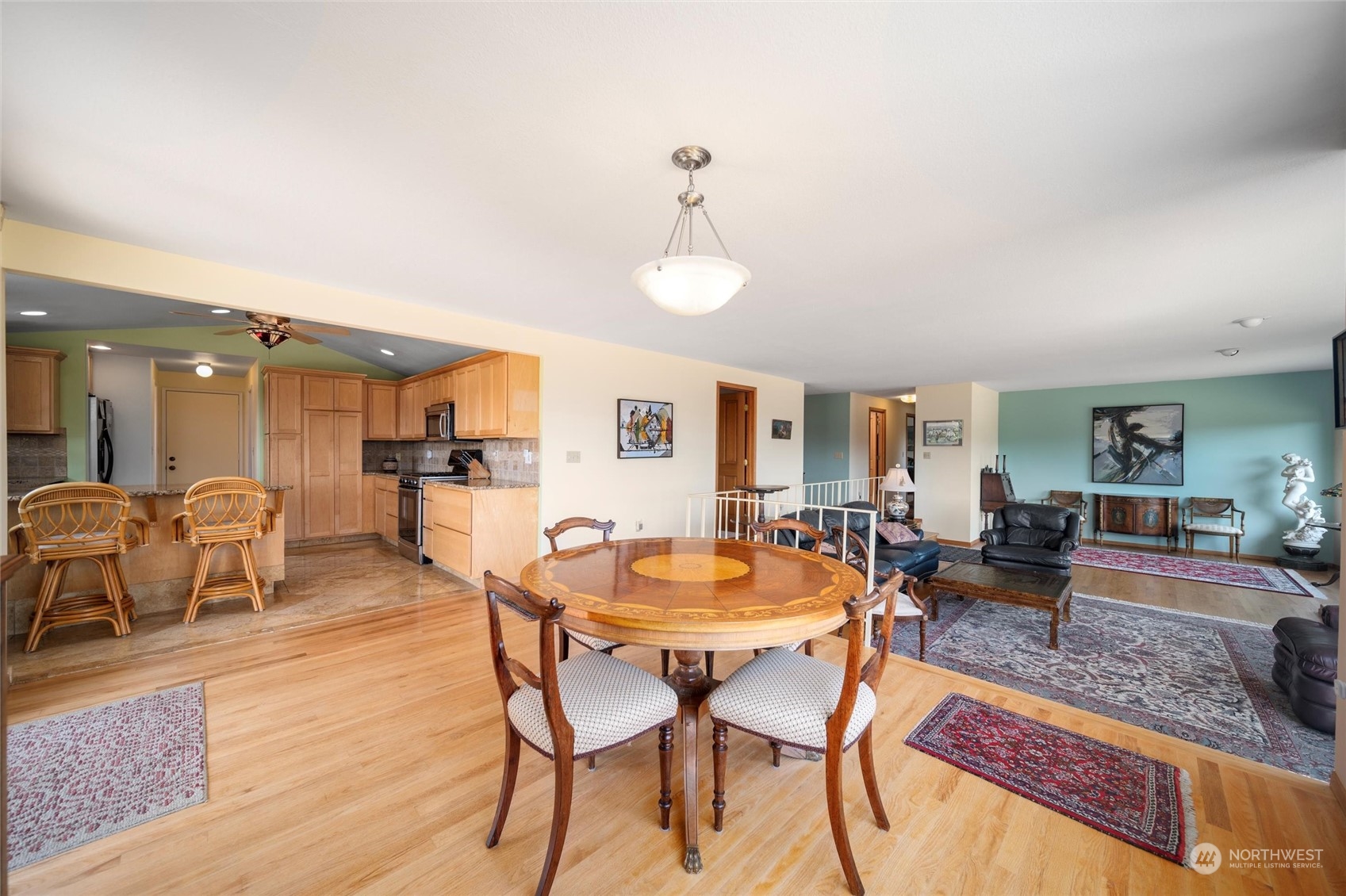 13622 Trumpeter Lane Mount Vernon, WA 98273 - Photo 18 of 40 a dining room with furniture a rug and wooden floor