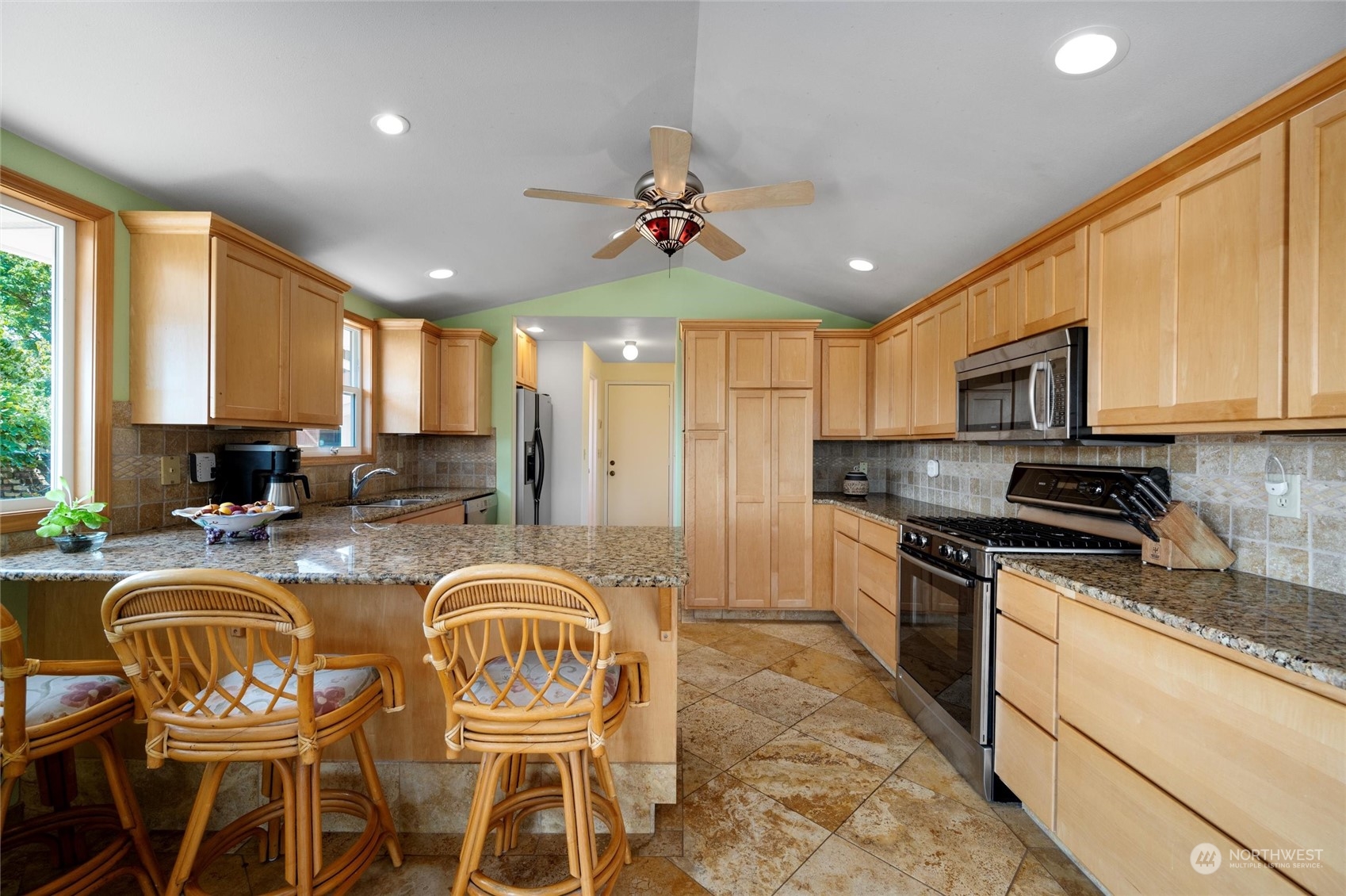 13622 Trumpeter Lane Mount Vernon, WA 98273 - Photo 22 of 40 a kitchen with granite countertop lots of counter top space appliances and a window