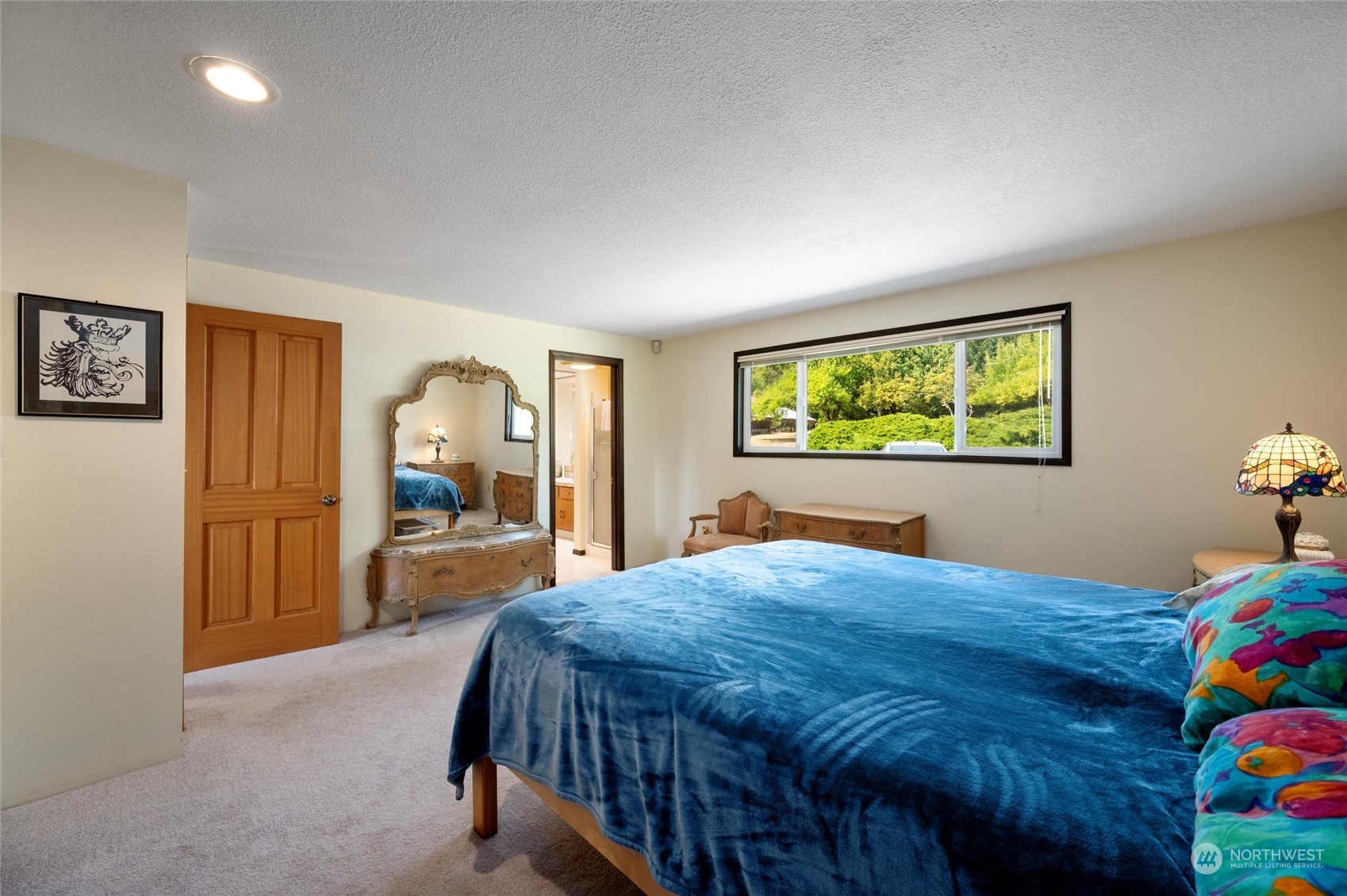 13622 Trumpeter Lane Mount Vernon, WA 98273 - Photo 27 of 40 a bedroom with a bed and large windows