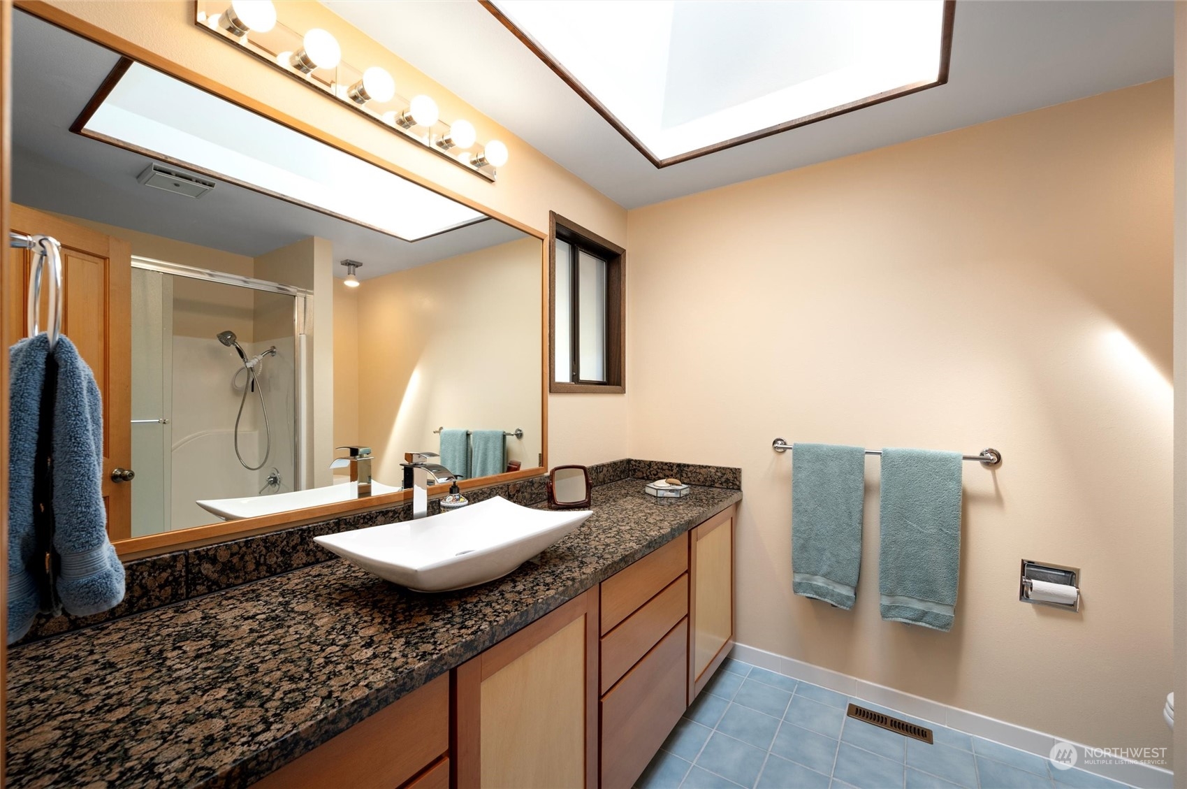 13622 Trumpeter Lane Mount Vernon, WA 98273 - Photo 28 of 40 a bathroom with a granite countertop sink and a mirror