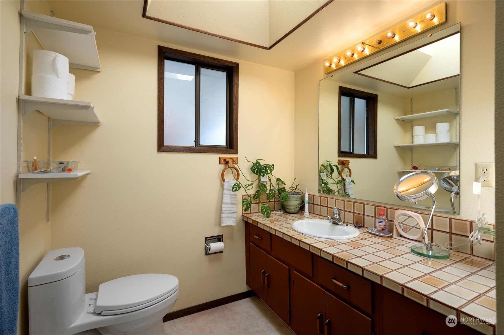 13622 Trumpeter Lane Mount Vernon, WA 98273 - Photo 30 of 40 a bathroom with a granite countertop toilet sink and mirror