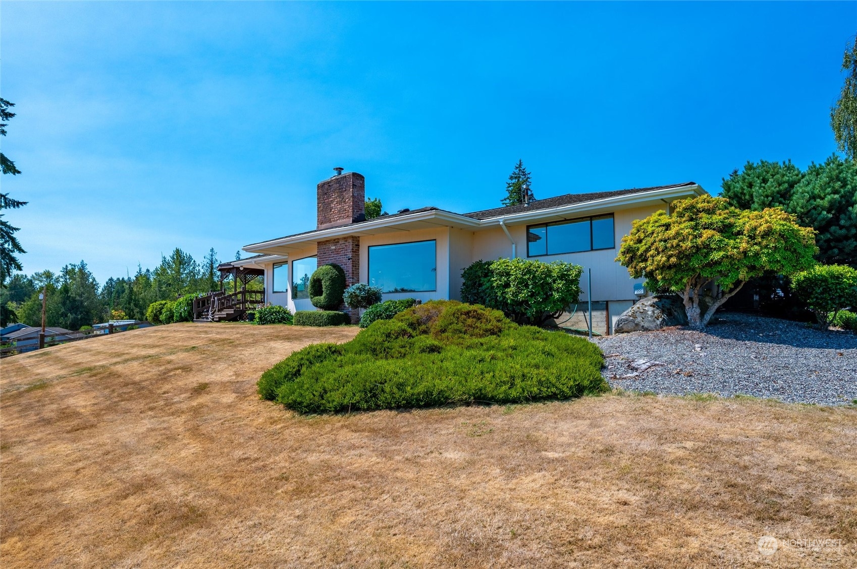 13622 Trumpeter Lane Mount Vernon, WA 98273 - Photo 34 of 40 a front view of a house with a yard and garage