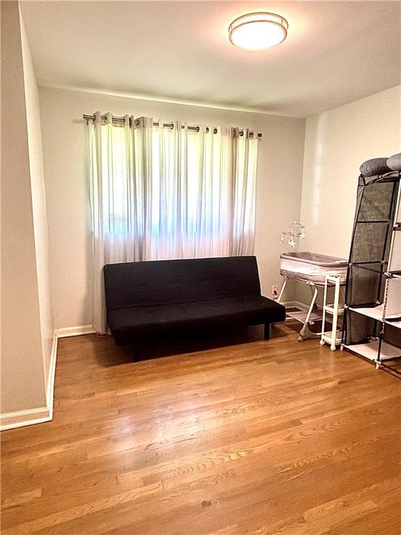 4030 Stonewall Tell Road Atlanta, GA 30349 - Photo 14 of 23 a living room with a bed furniture and a window