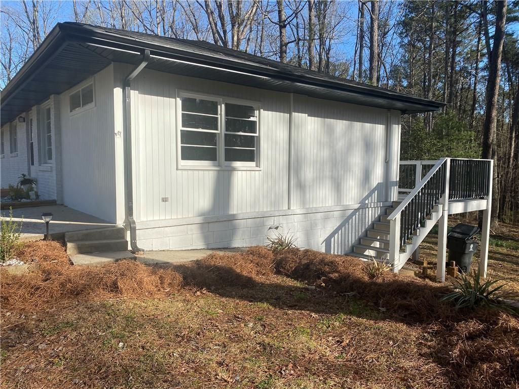4030 Stonewall Tell Road Atlanta, GA 30349 - Photo 20 of 23 a front view of a house with a yard
