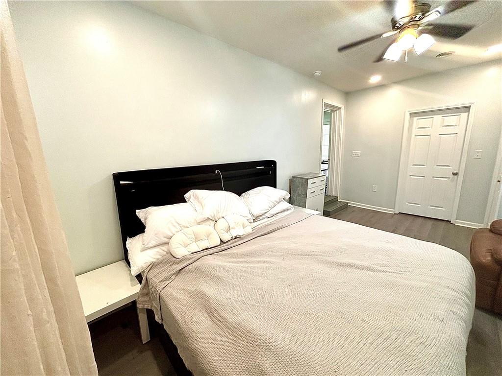 4030 Stonewall Tell Road Atlanta, GA 30349 - Photo 10 of 23 a large white bed in a white room