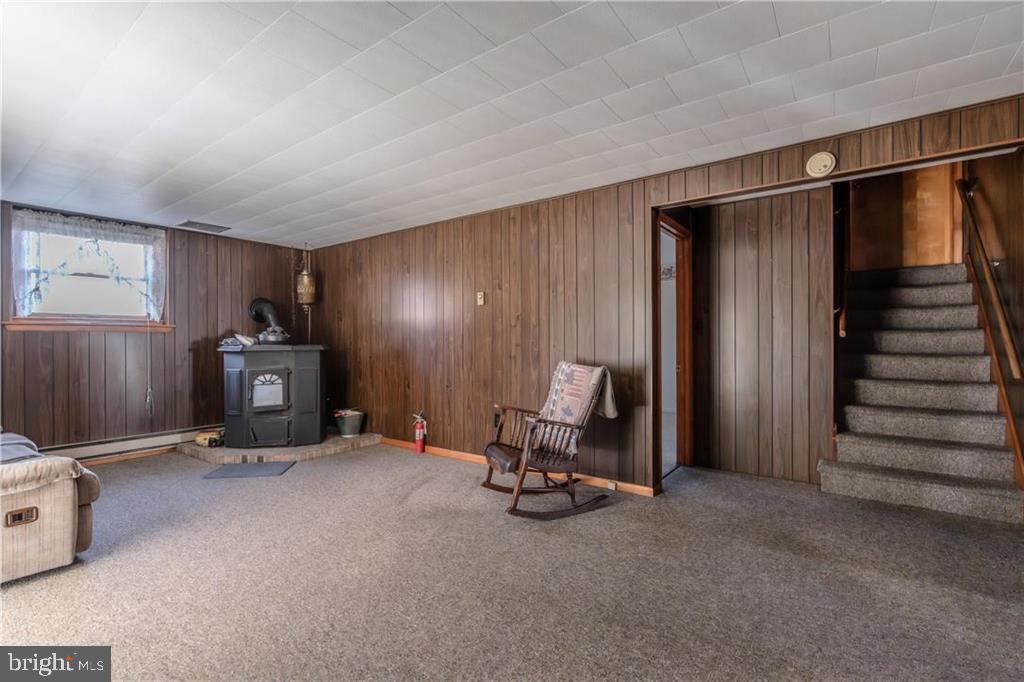 91 School Drive New Ringgold, PA 17960 - Photo 33 of 41 Lower Level Family Room with Wood Burning Stove