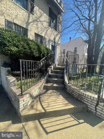 a view of balcony with wooden floor