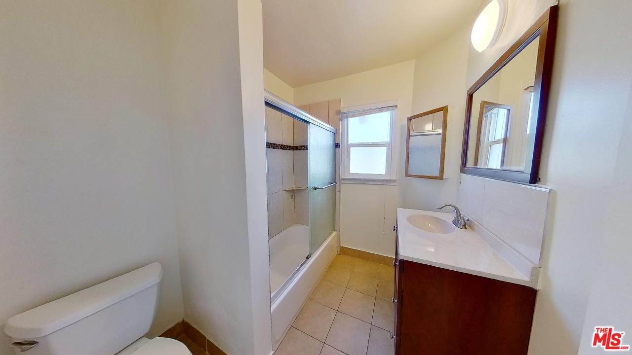 2027 Euclid Street, Unit E Santa Monica, CA 90405 - Photo 12 of 18 a bathroom with a sink a toilet and shower