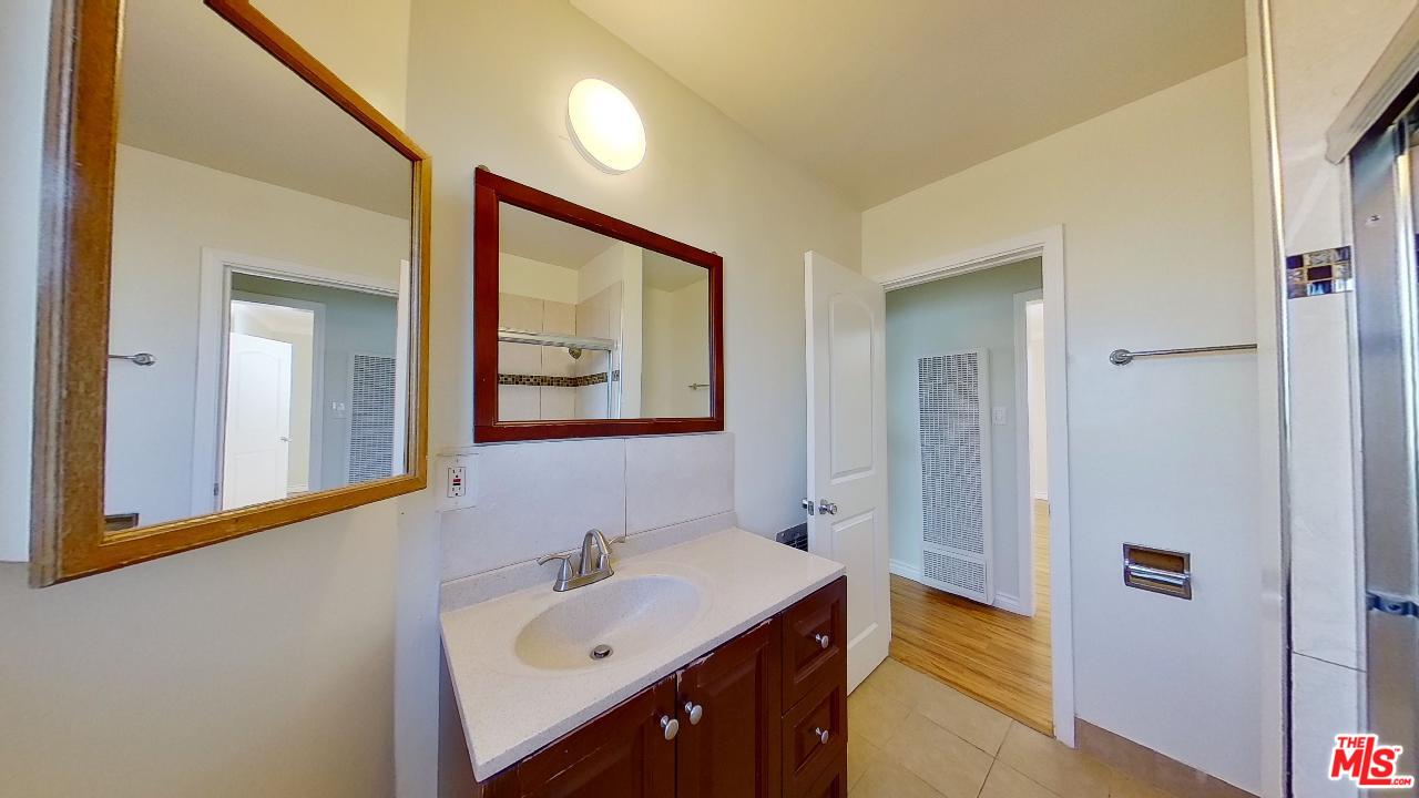 2027 Euclid Street, Unit E Santa Monica, CA 90405 - Photo 13 of 18 a bathroom with a sink and a mirror