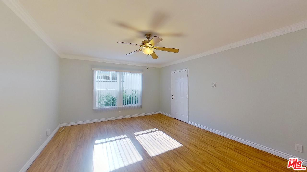 2027 Euclid Street, Unit E Santa Monica, CA 90405 - Photo 3 of 18 wooden floor in an empty room with a window