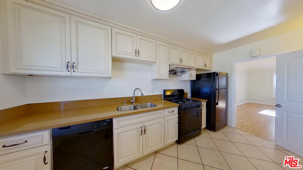 2027 Euclid Street, Unit E Santa Monica, CA 90405 - Photo 6 of 18 a kitchen with a sink and cabinets