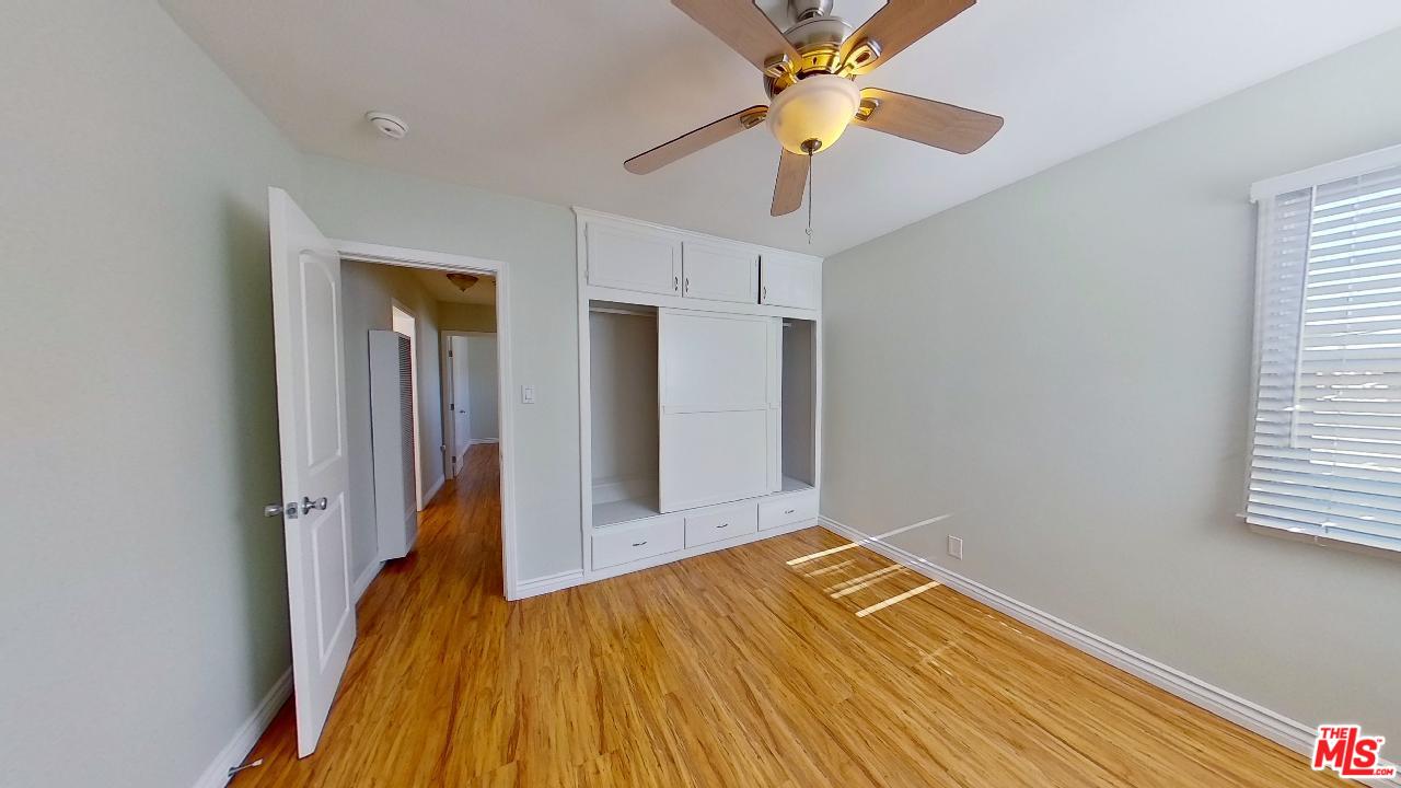 2027 Euclid Street, Unit E Santa Monica, CA 90405 - Photo 9 of 18 wooden floor in an empty room with a window
