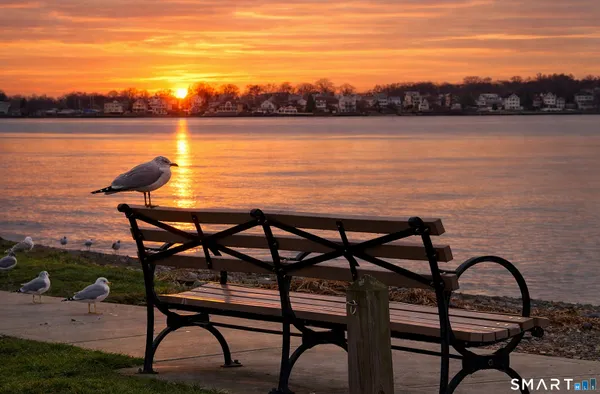 a view of a lake from a outdoor seating