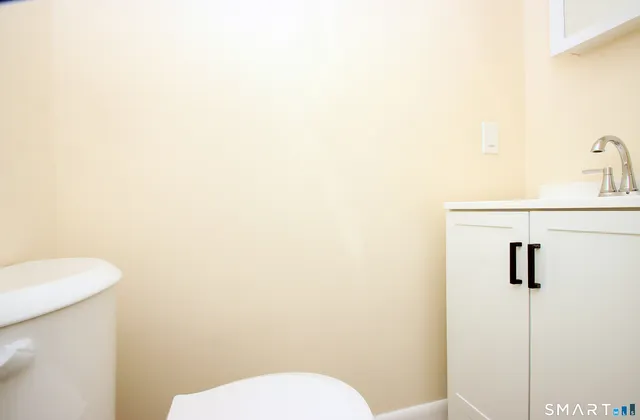 a bathroom with a toilet and a sink