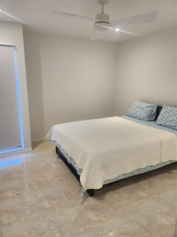 4160 Inverrary Drive, Unit 311 Lauderhill, FL 33319 - Photo 4 of 15 a bedroom with a bed and a rug