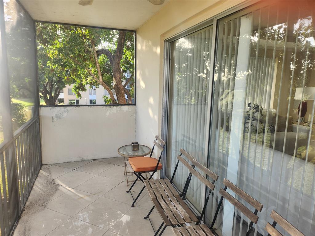 4160 Inverrary Drive, Unit 311 Lauderhill, FL 33319 - Photo 10 of 15 a outdoor living space with furniture