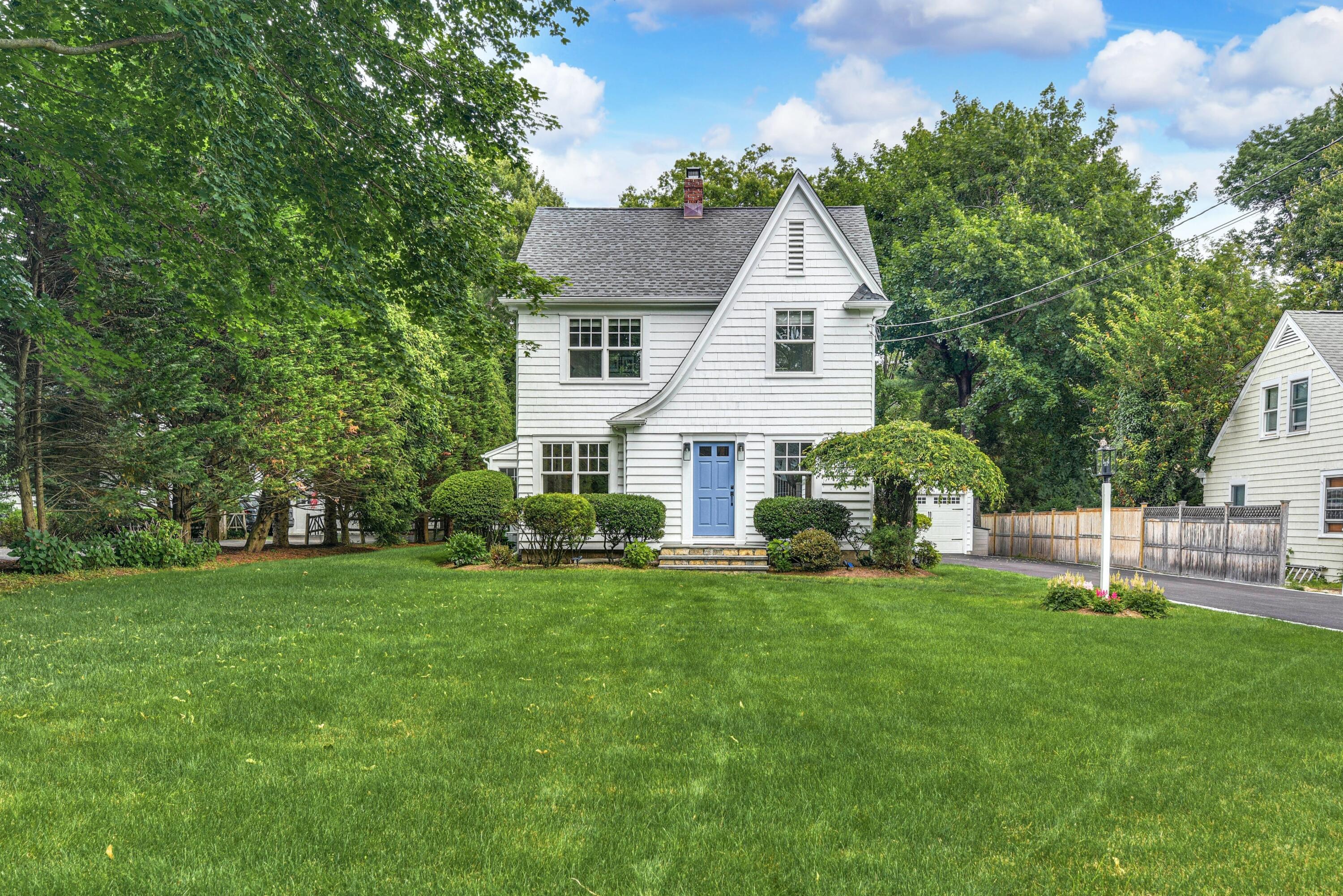 13 Sunset Road Darien, CT 06820 - Photo 1 of 28 a aerial view of a house with a yard and sitting area
