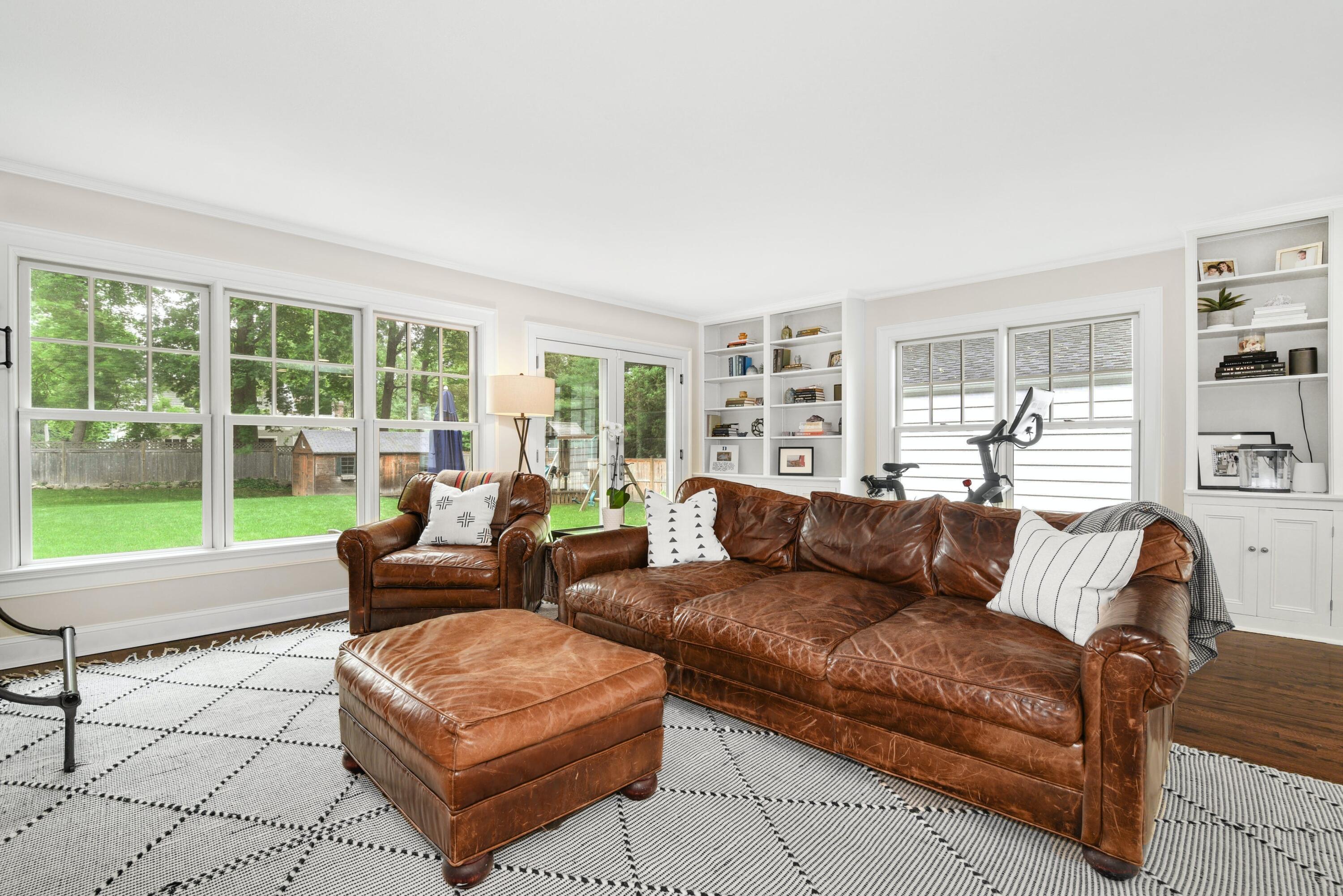 13 Sunset Road Darien, CT 06820 - Photo 11 of 28 a living room with furniture and a large window with outer view