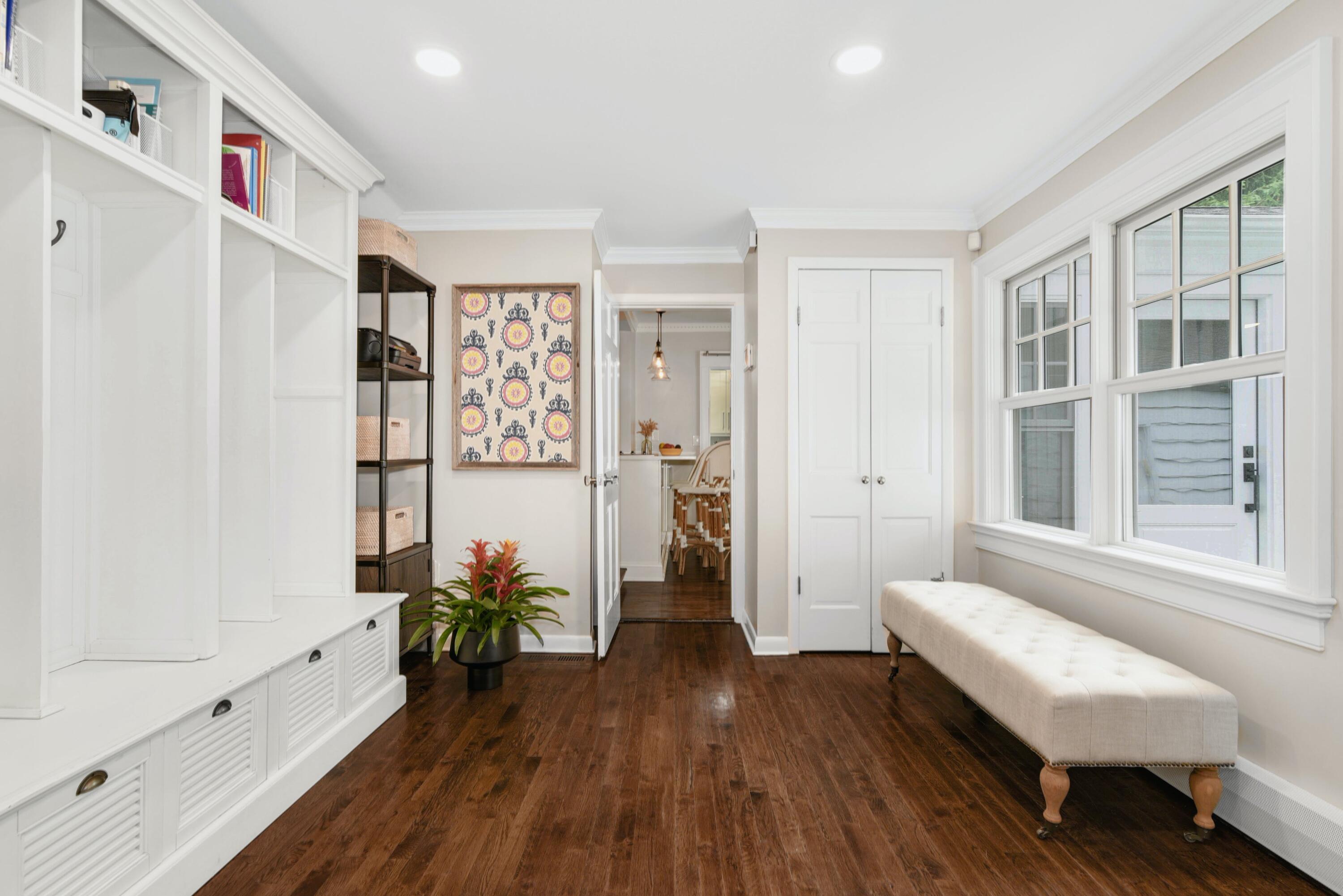 13 Sunset Road Darien, CT 06820 - Photo 12 of 28 a hallway with wooden floor and furniture