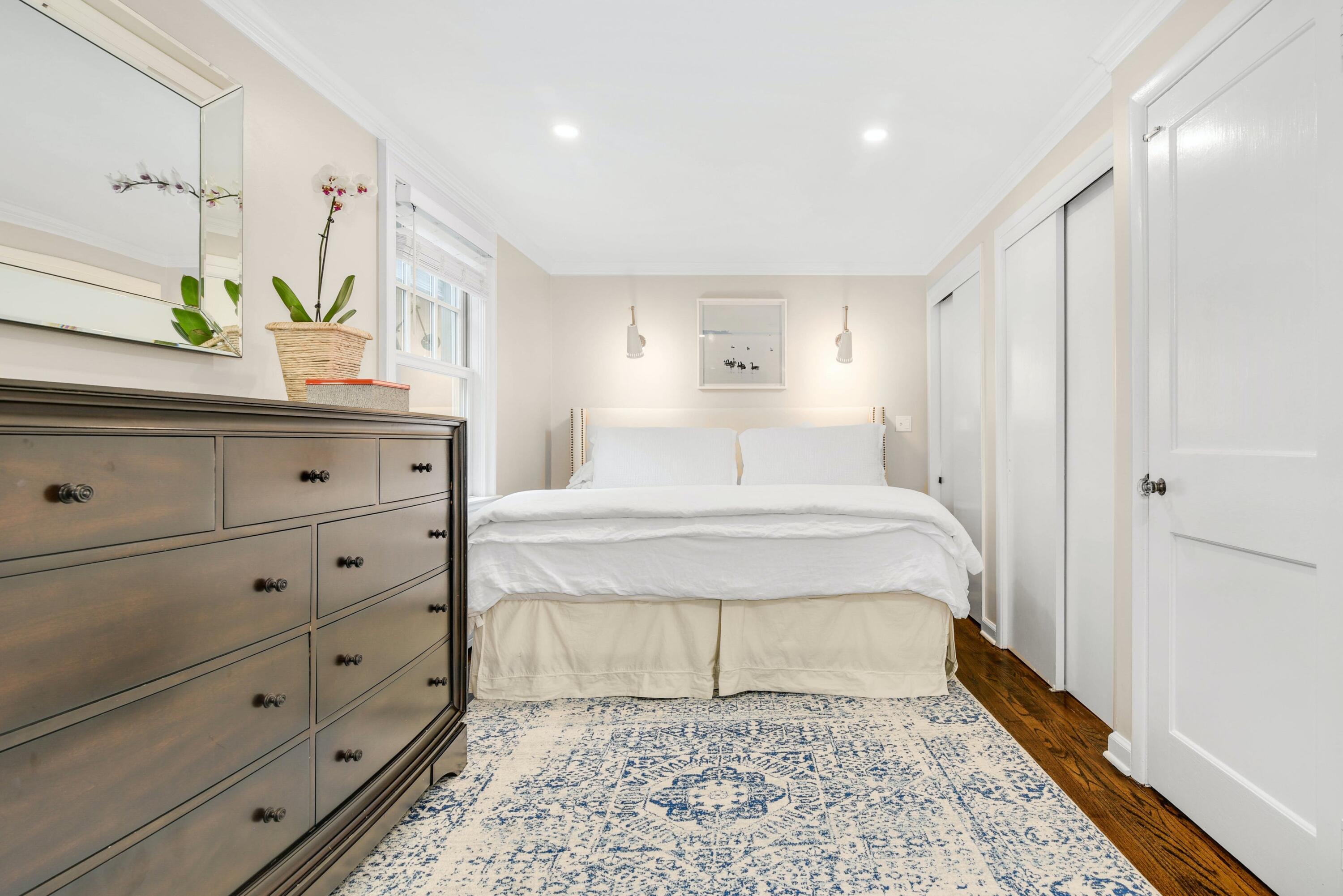 13 Sunset Road Darien, CT 06820 - Photo 16 of 28 a bedroom with a bed and a dresser