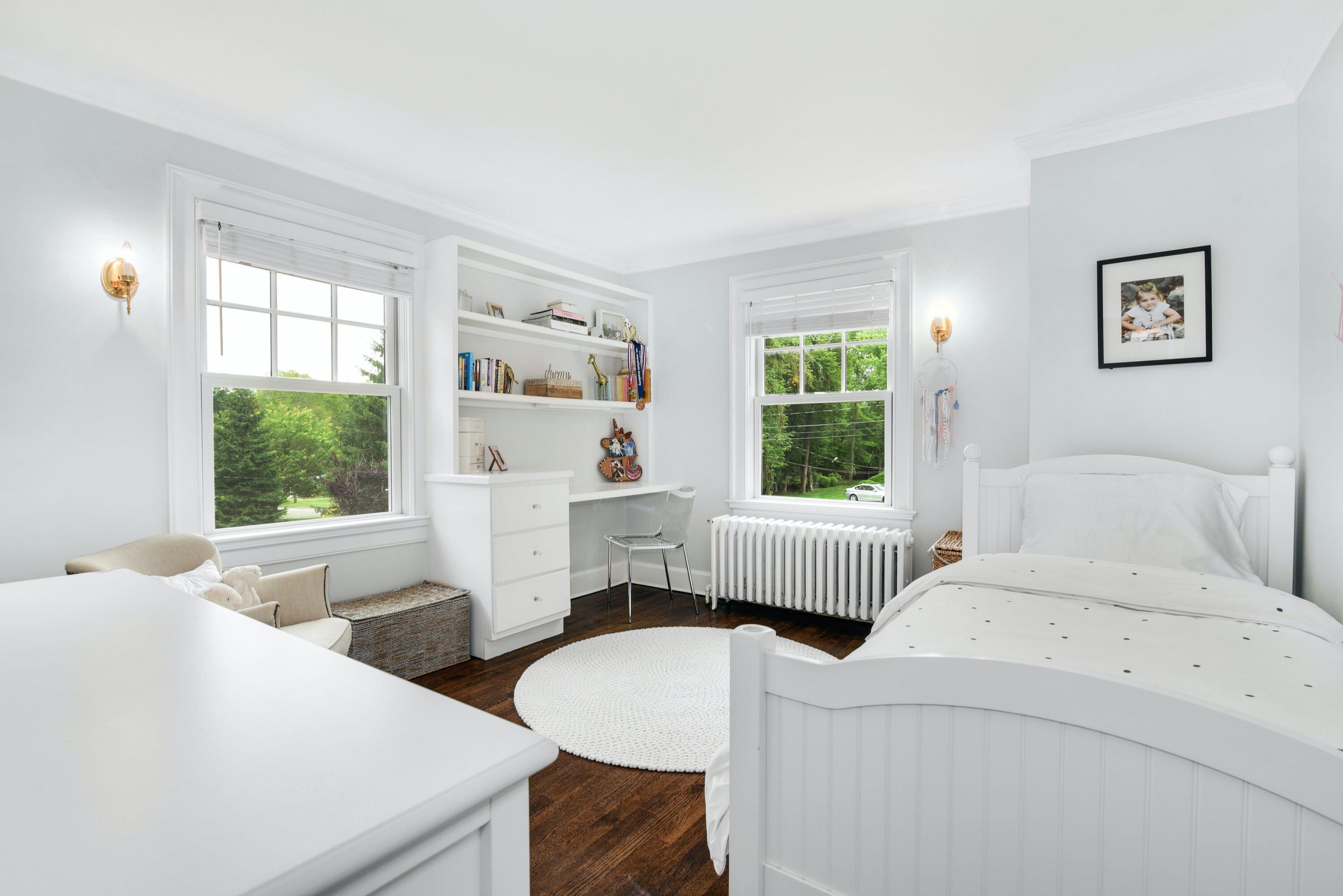 13 Sunset Road Darien, CT 06820 - Photo 19 of 28 a bedroom with two beds and a window