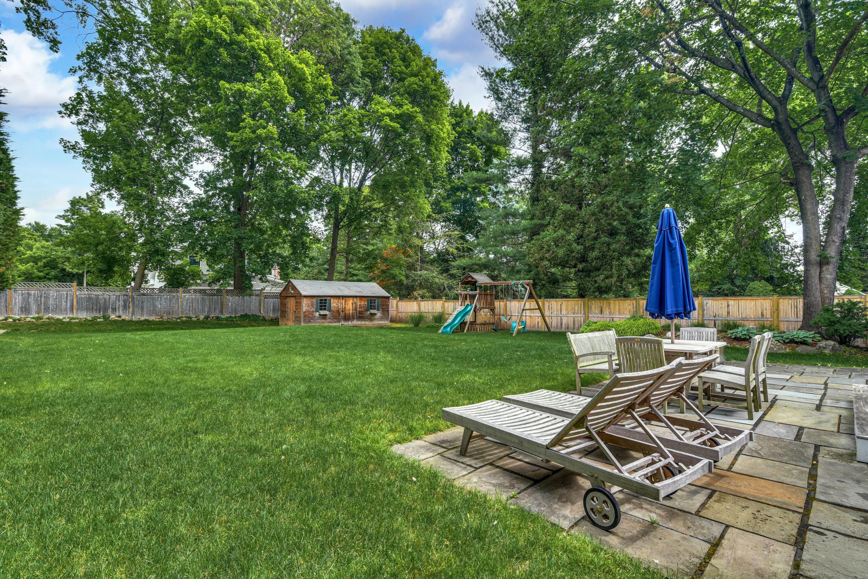 13 Sunset Road Darien, CT 06820 - Photo 24 of 28 a view of a backyard with sitting area