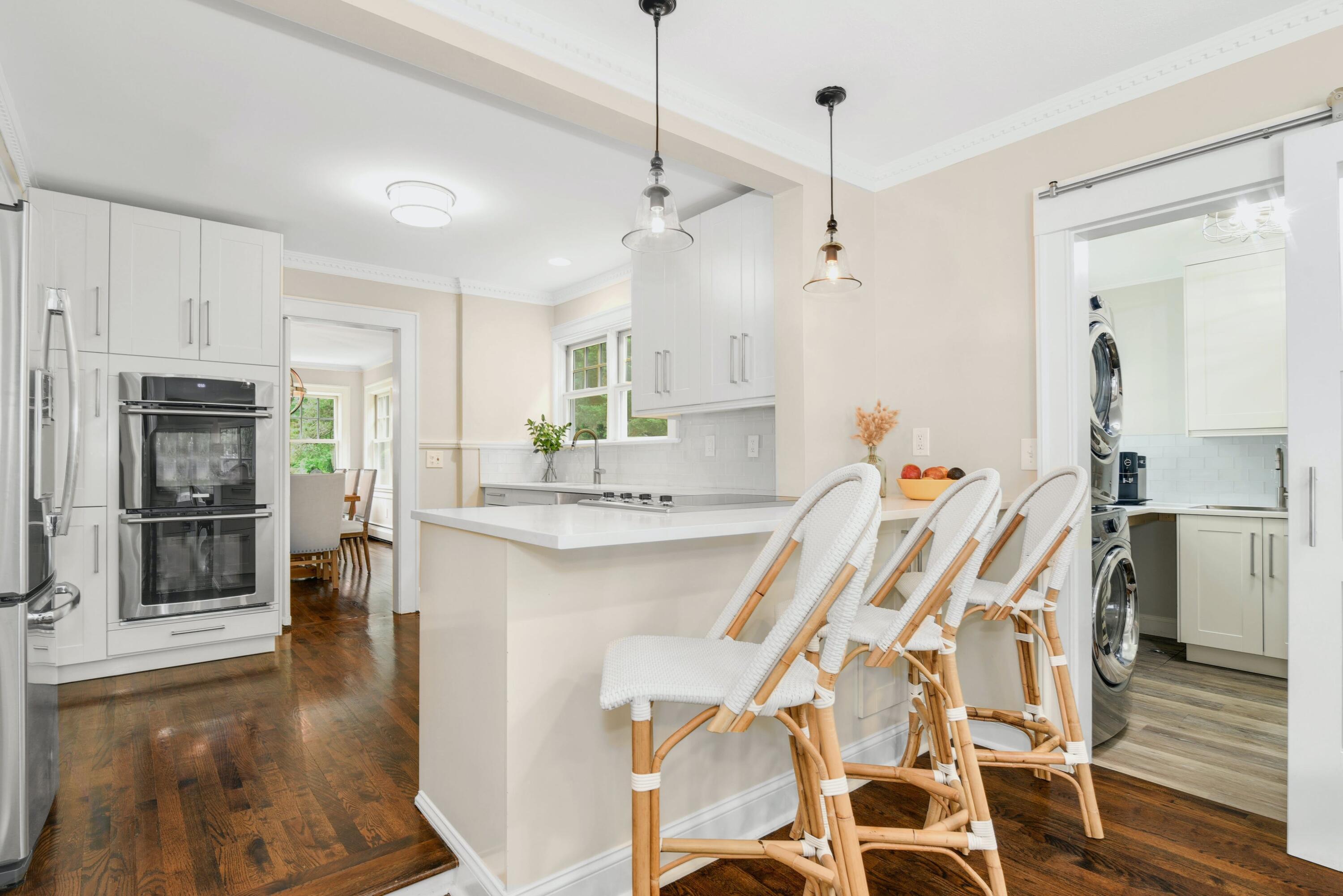 13 Sunset Road Darien, CT 06820 - Photo 8 of 28 a kitchen with stainless steel appliances kitchen island granite countertop a refrigerator and microwave