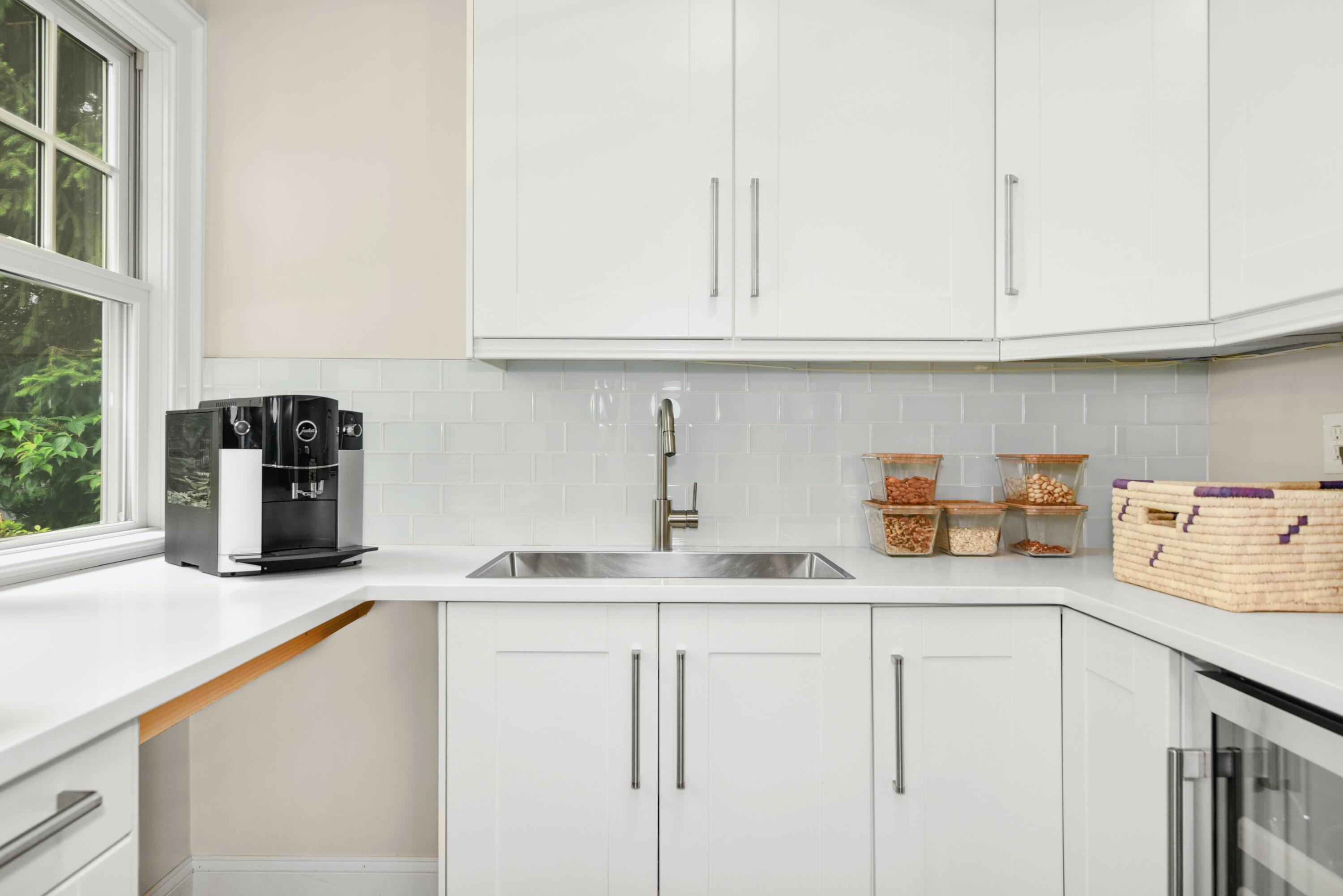 13 Sunset Road Darien, CT 06820 - Photo 9 of 28 a kitchen with stainless steel appliances granite countertop a sink and dishwasher with white cabinets
