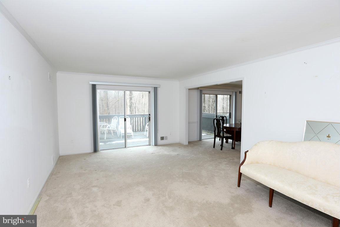 201 Hermleigh Road Silver Spring, MD 20902 - Photo 4 of 26 Living Room with Slider to Deck