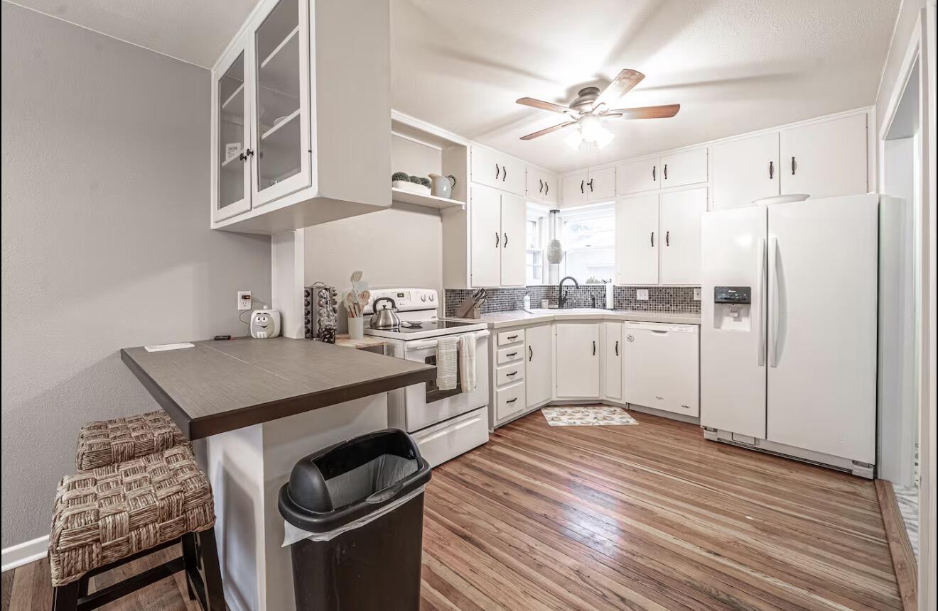 2816 37th Street Lubbock, TX 79413 - Photo 12 of 19 a kitchen with a sink appliances and cabinets