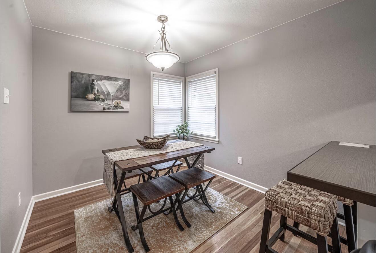 2816 37th Street Lubbock, TX 79413 - Photo 13 of 19 a view of a dining room with furniture window and wooden floor