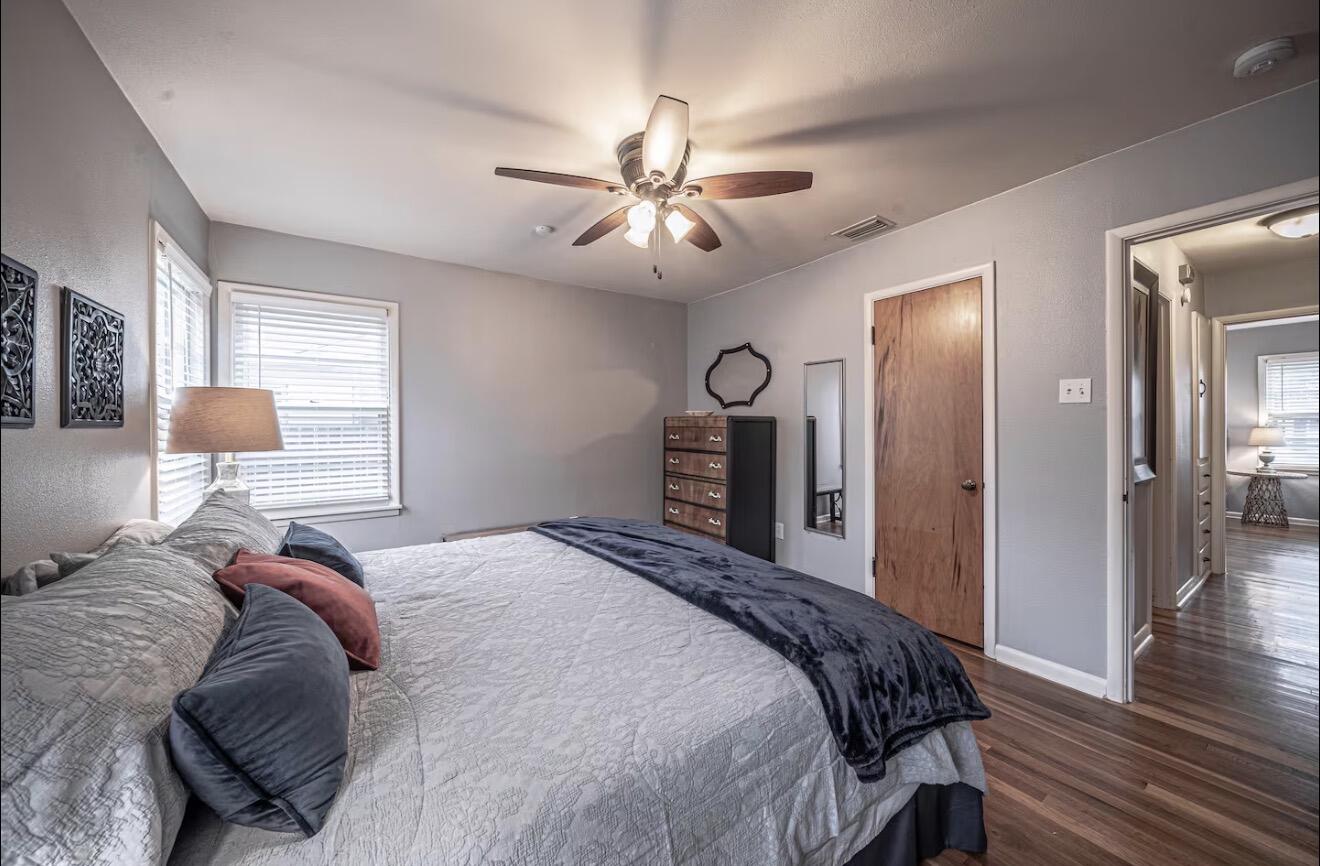 2816 37th Street Lubbock, TX 79413 - Photo 16 of 19 a bed room with a bed and a lamp