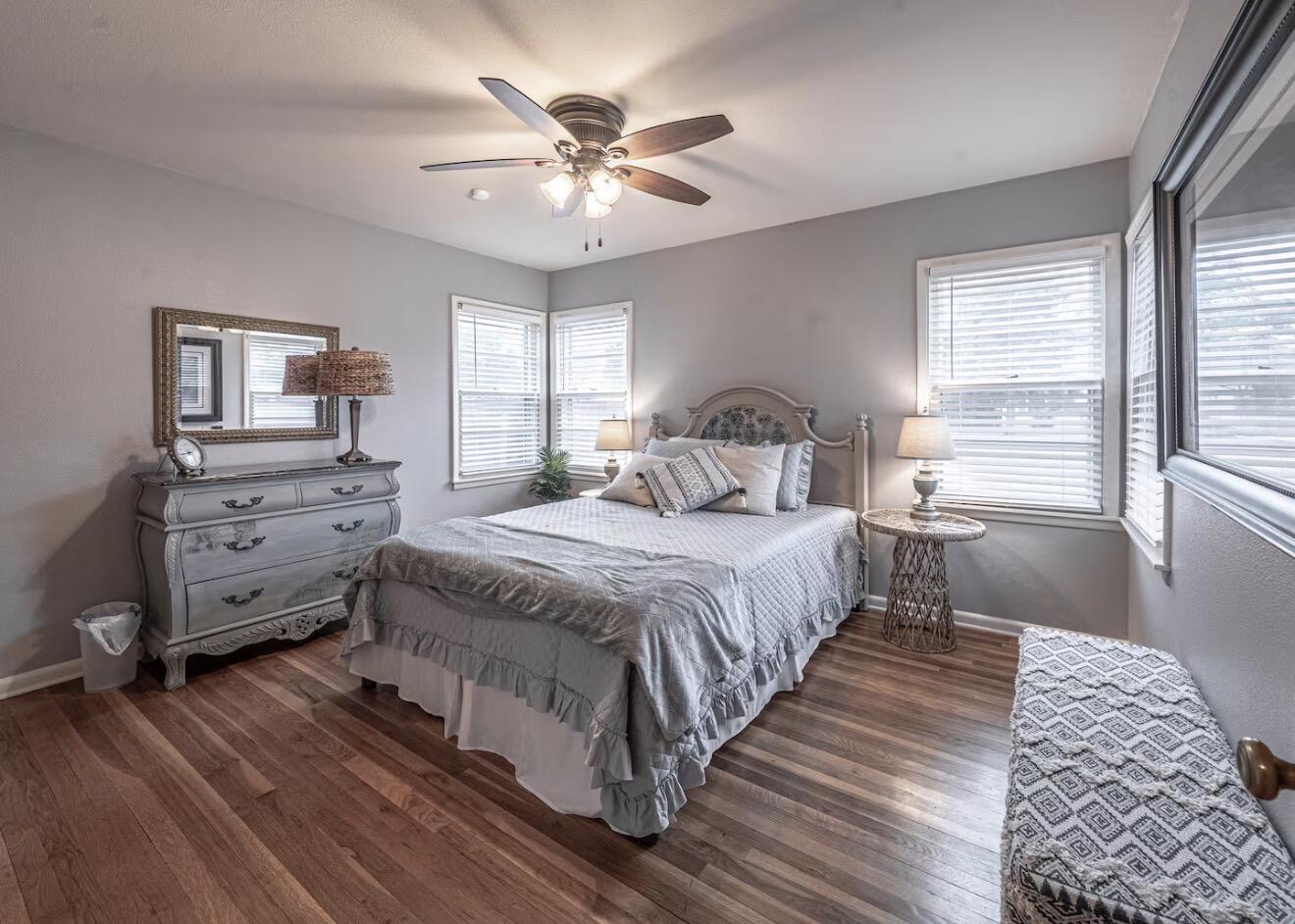 2816 37th Street Lubbock, TX 79413 - Photo 19 of 19 a bedroom with a bed and a chandelier